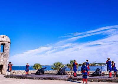 The soldiers in traditional Spanish Cloths show to shooting cannon at the Castillo San Marcos is one of the oldest America cities.